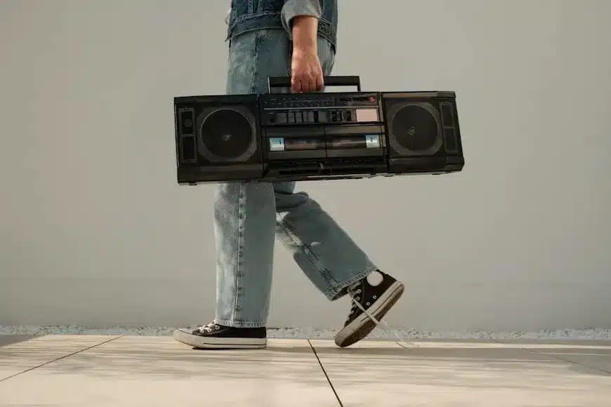 A man walking with a boombox on his back