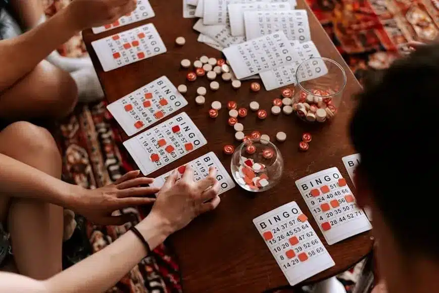 a group of people sitting around a table playing a game
