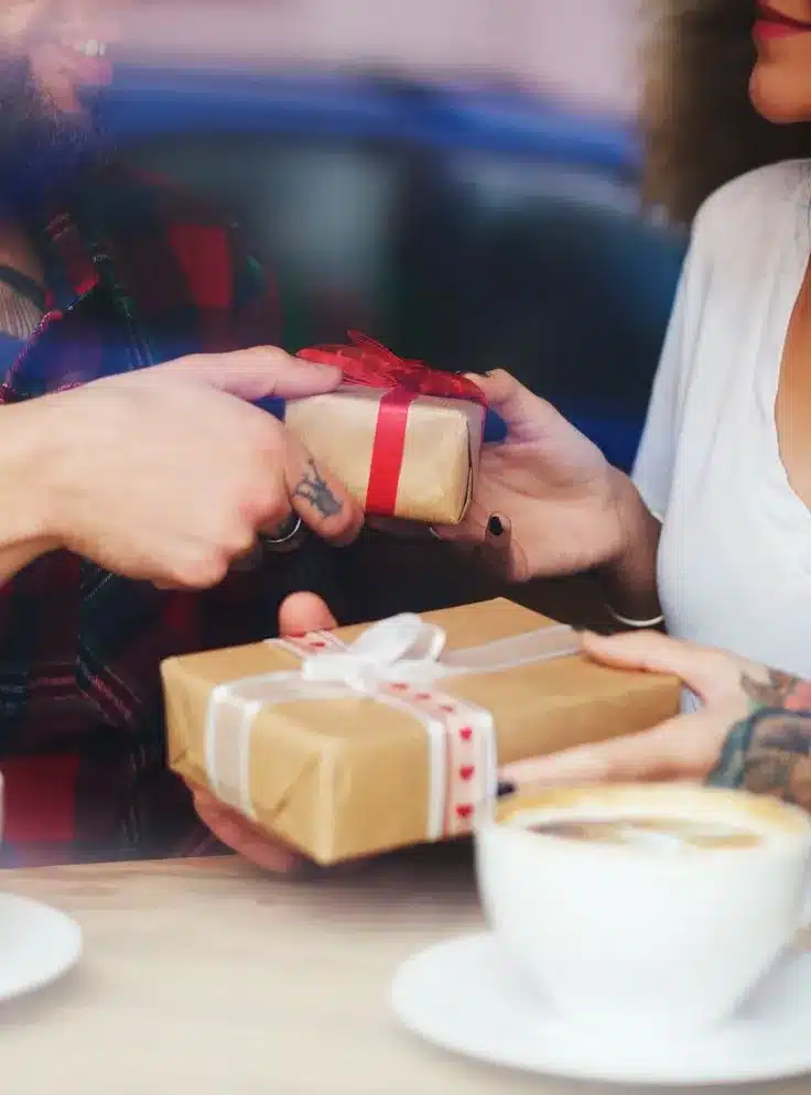 Valentine's Day gift ideas for him - couple exchanging gifts