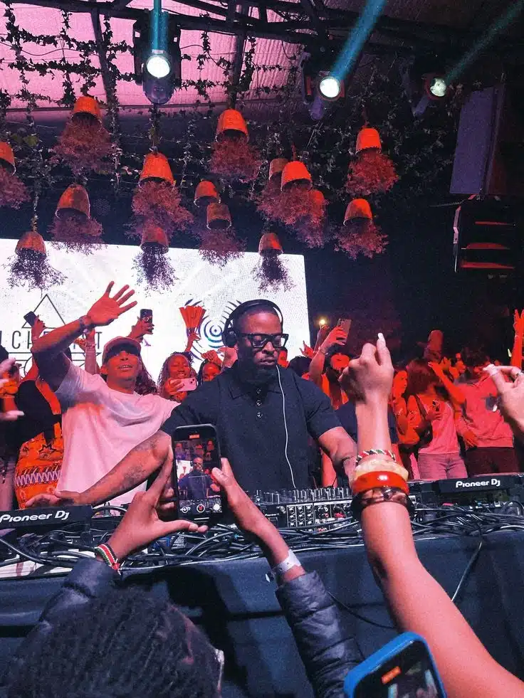 DJ mixing popular Amapiano songs during a lively nightlife session
