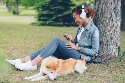 a lady with a pet listening to music